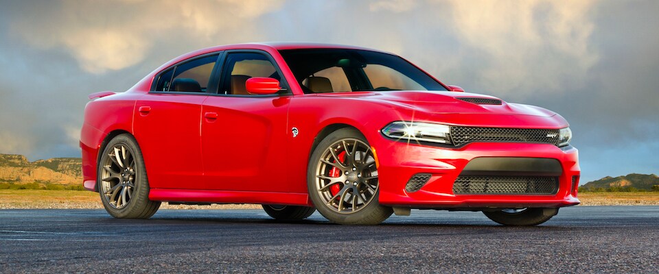 2019 Dodge Charger A red 2019 Dodge Charger parked in front of a desert landscape