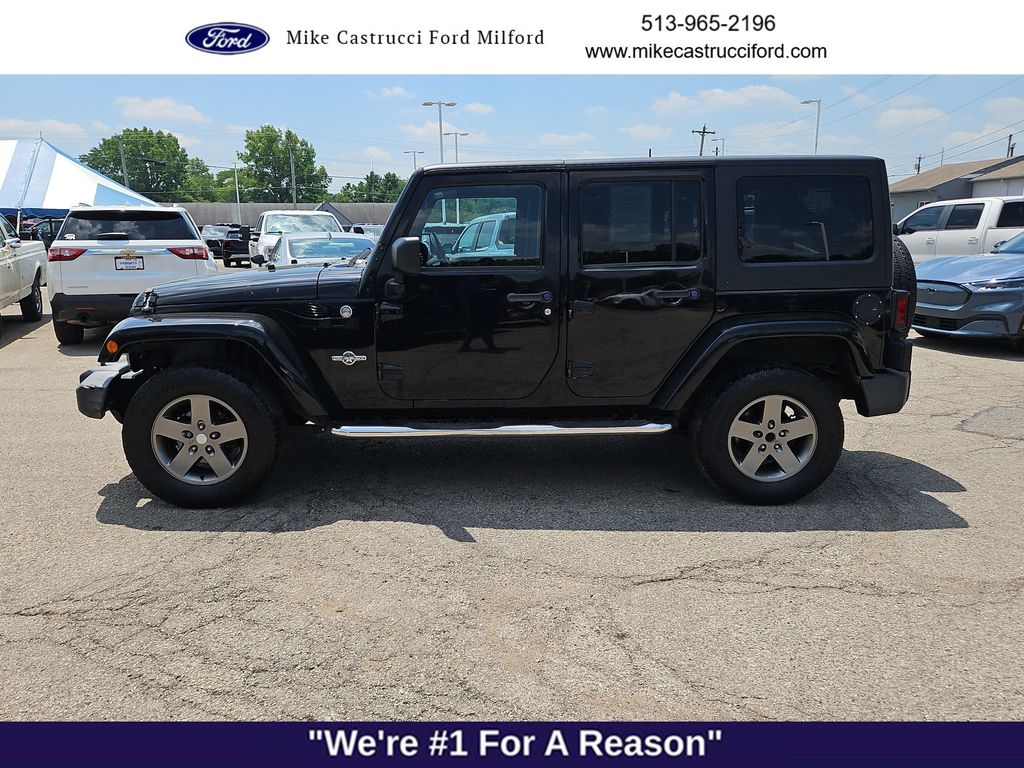 Used 2013 Jeep Wrangler Unlimited Sport with VIN 1C4BJWDG0DL579804 for sale in Milford, OH