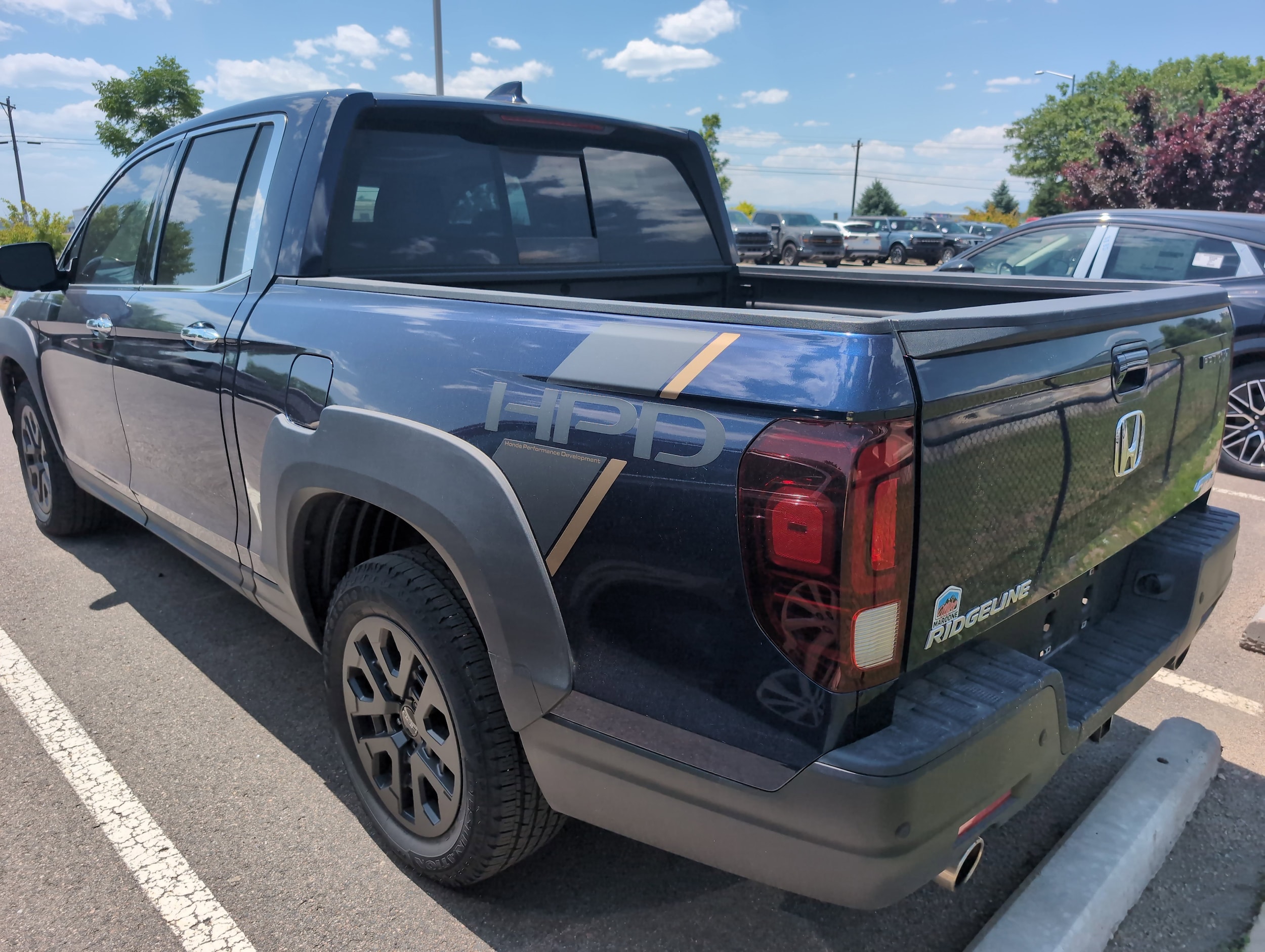 Certified 2022 Honda Ridgeline RTL-E with VIN 5FPYK3F7XNB031873 for sale in Longmont, CO
