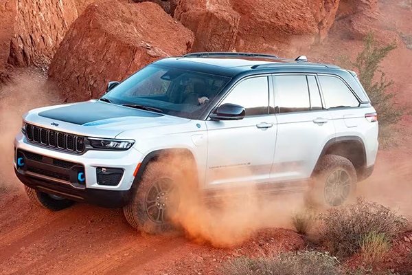 Jeep Grand Cherokee driving on rought desert terrain