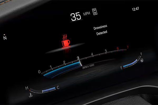 Jeep Grand Cherokee speedometer with a warning that says 'drowsiness detected'