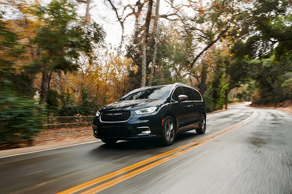 Pacifica driving down a road