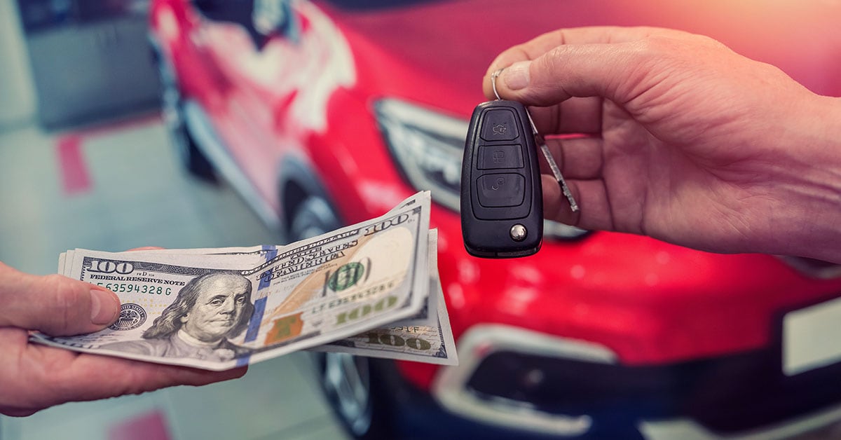 Cash and keys representing a vehicle's trade-in value