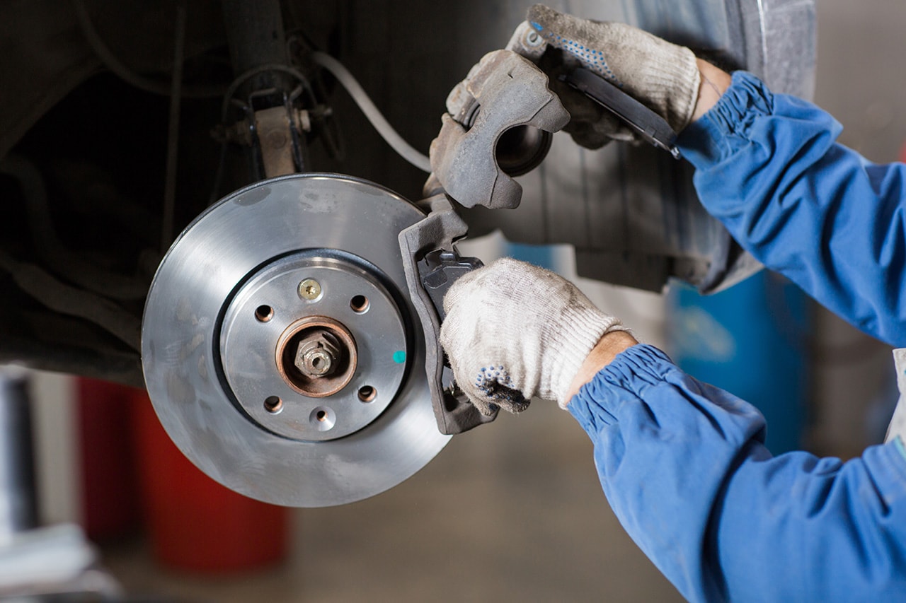 Jeep service technician working on brakes