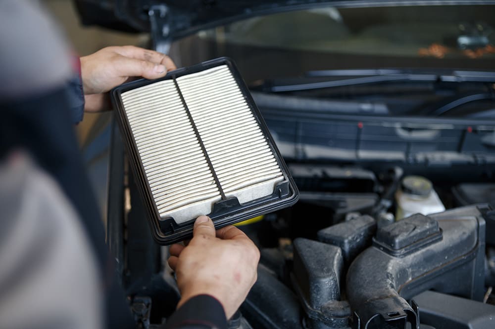 Inspecting engine air filter as part of a Jeep service schedule