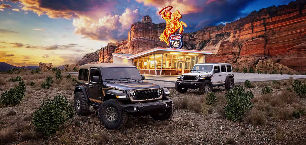 A pair of 2027 Jeep Wrangler Laredo models parked in the desert