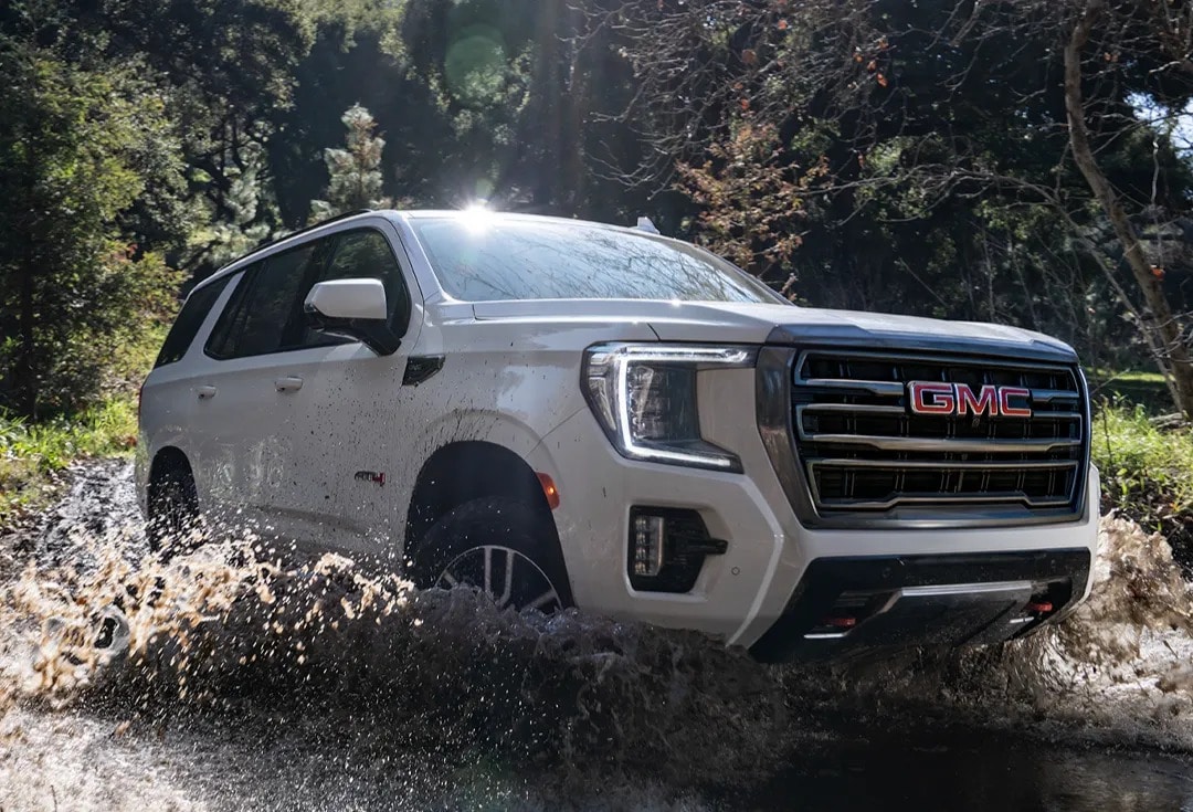 2025%20GMC%20Yukon%20AT4%20Driving%20Through%20Mud.jpeg