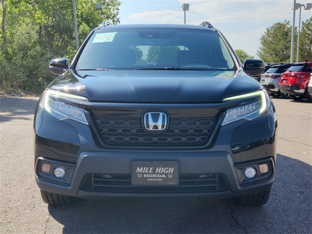 Used 2021 Honda Passport Touring with VIN 5FNYF8H93MB020124 for sale in Denver, CO