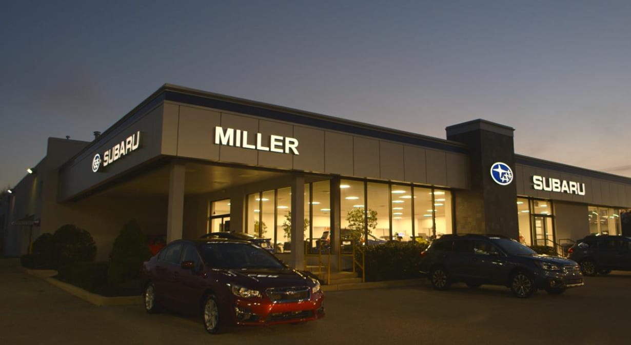 Miller Subaru dealership at dusk.