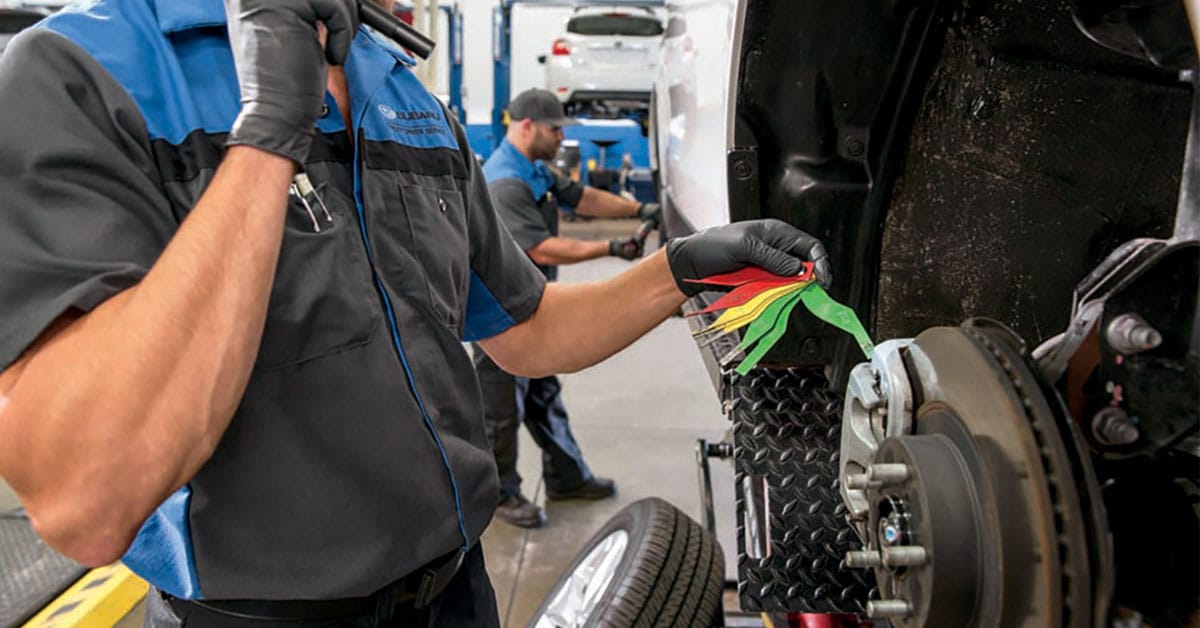 Technician performing Subaru brake service