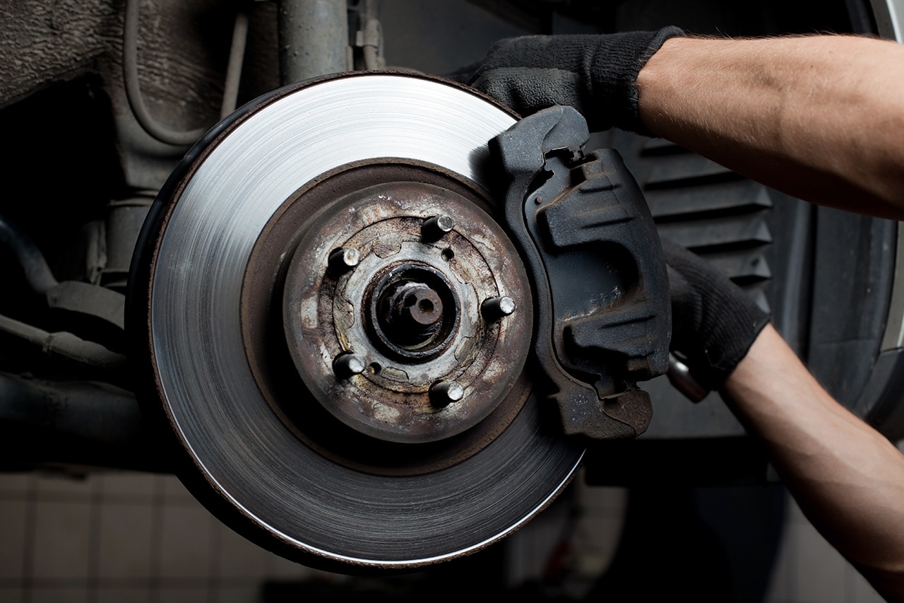 Technician performing Subaru brake repair