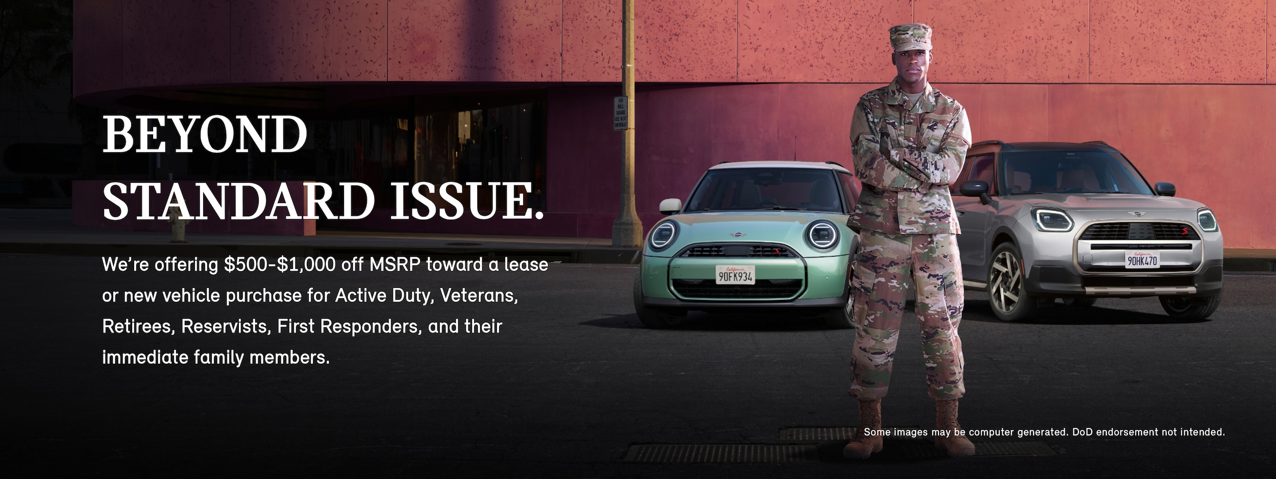 A man in a military uniform standing in front of a 2025 MINI Cooper S 2 Door and MINI Countryman S ALL4 with his arms crossed.