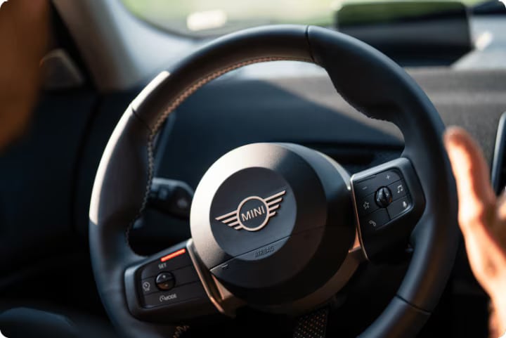 Close up of MINI vehicle steering wheel.