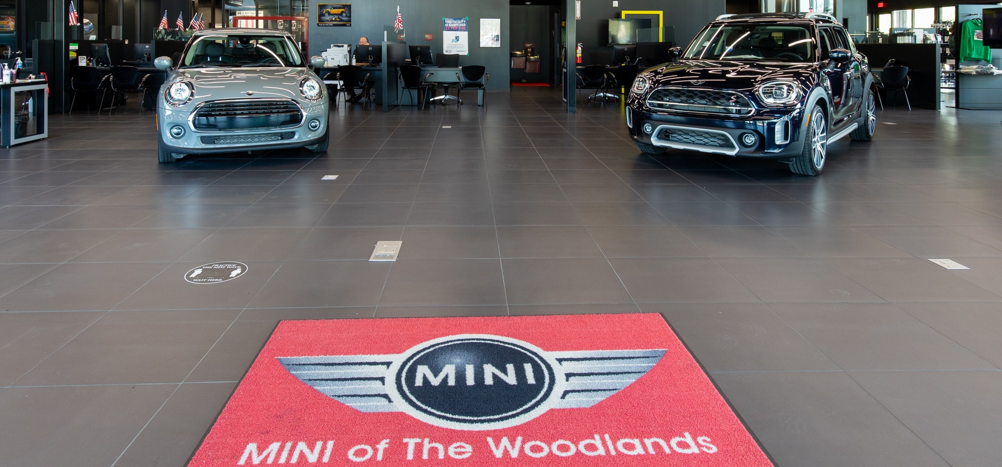Interior view of MINI of the Woodlands with two MINI facing the camera