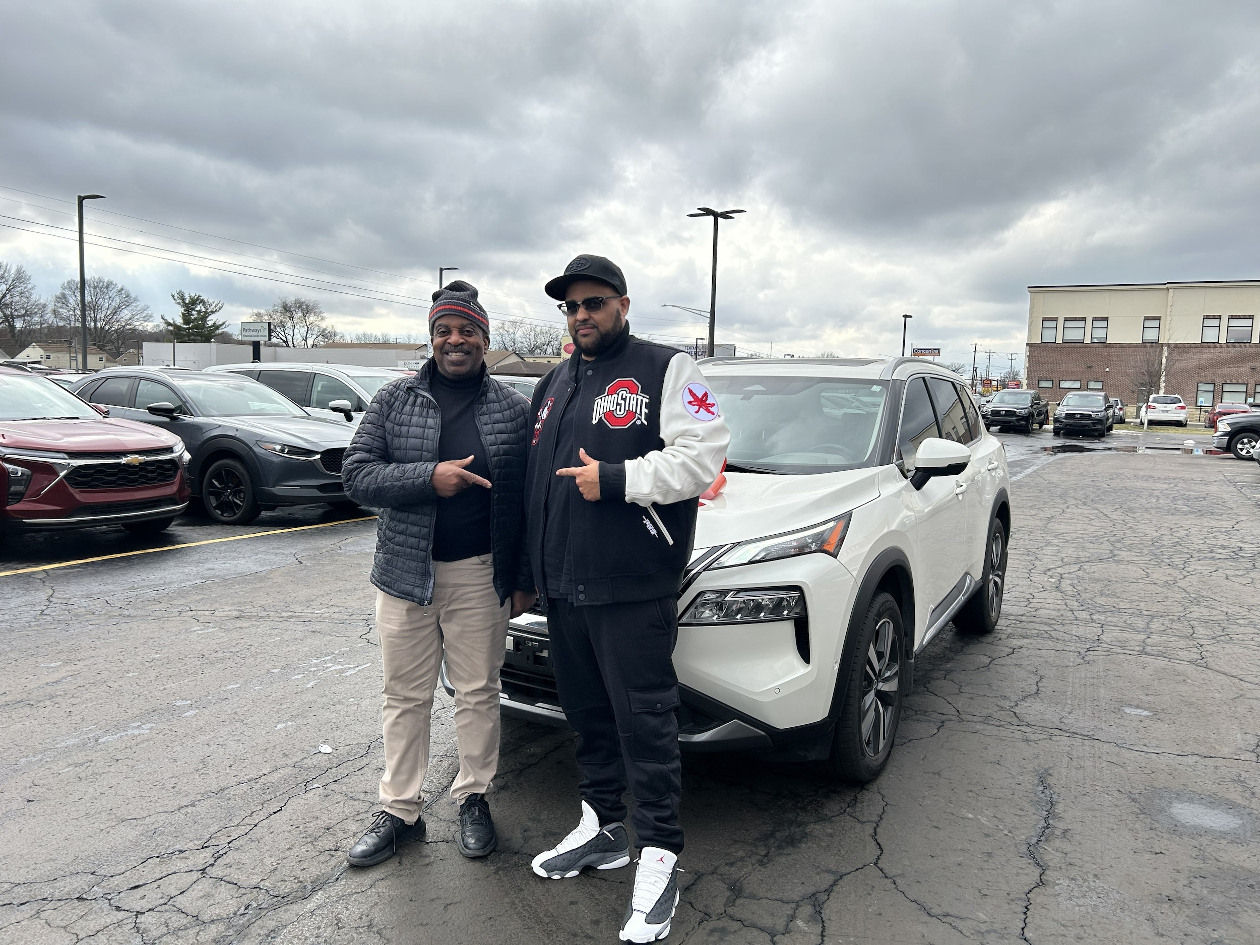 Happy Customer with their used Nissan Rogue from Miracle Motor Mart