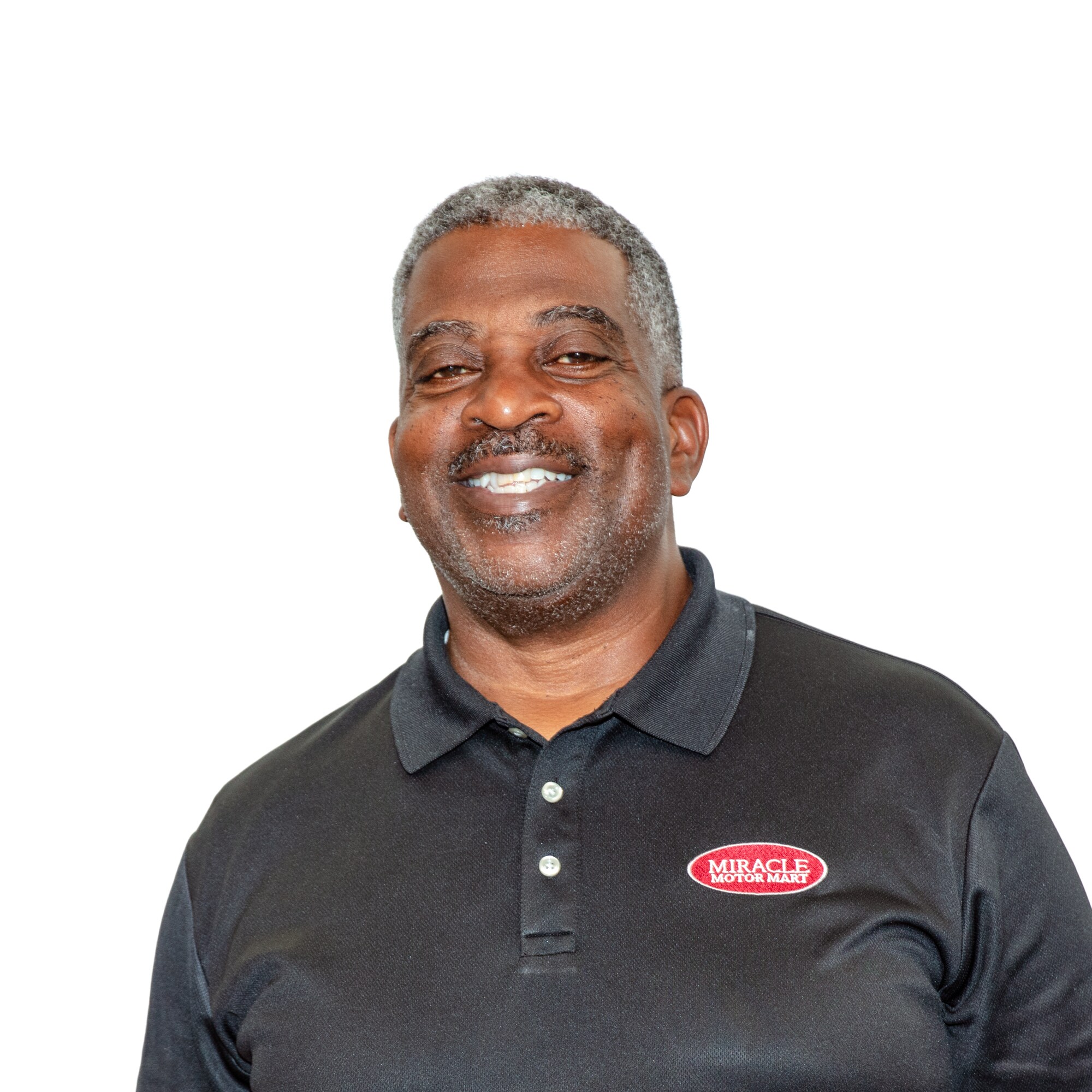  Person cheerfully signing documents.