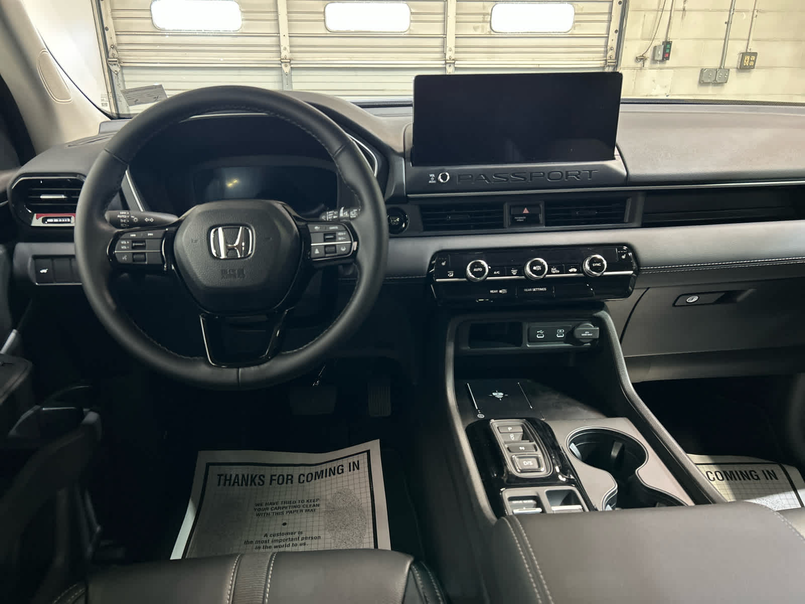 2026 Honda Passport interior showing the 12.3-inch touchscreen, digital gauge cluster, and center console