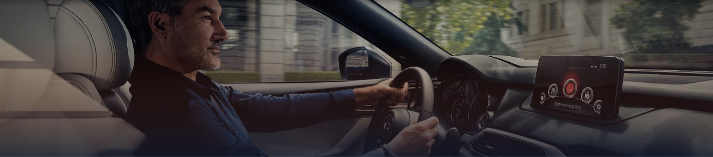 Man Driving Mazda Vehicle