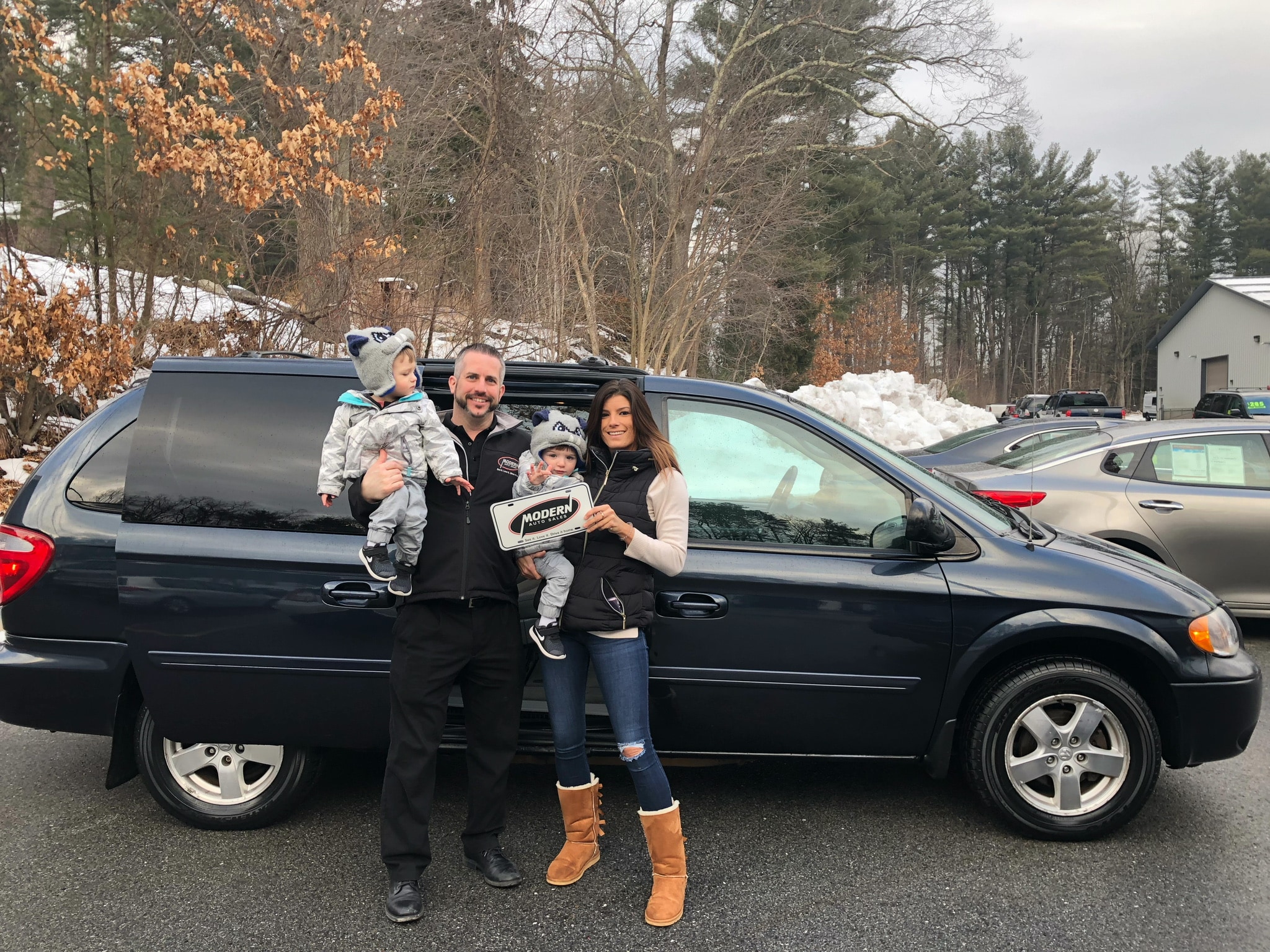 Happy Modern Auto Sales customer with new vehicle