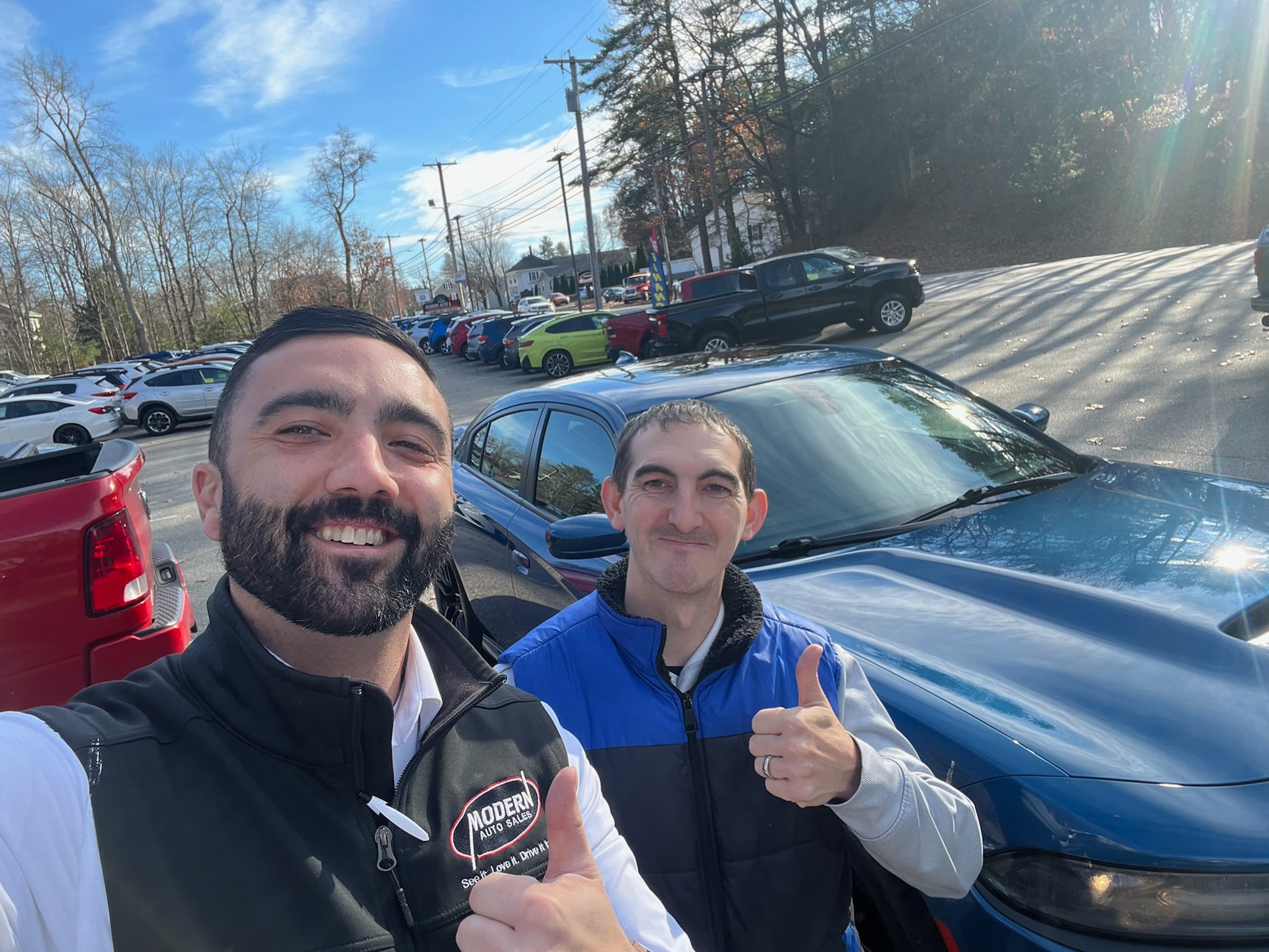 Happy Modern Auto Sales customer with new vehicle