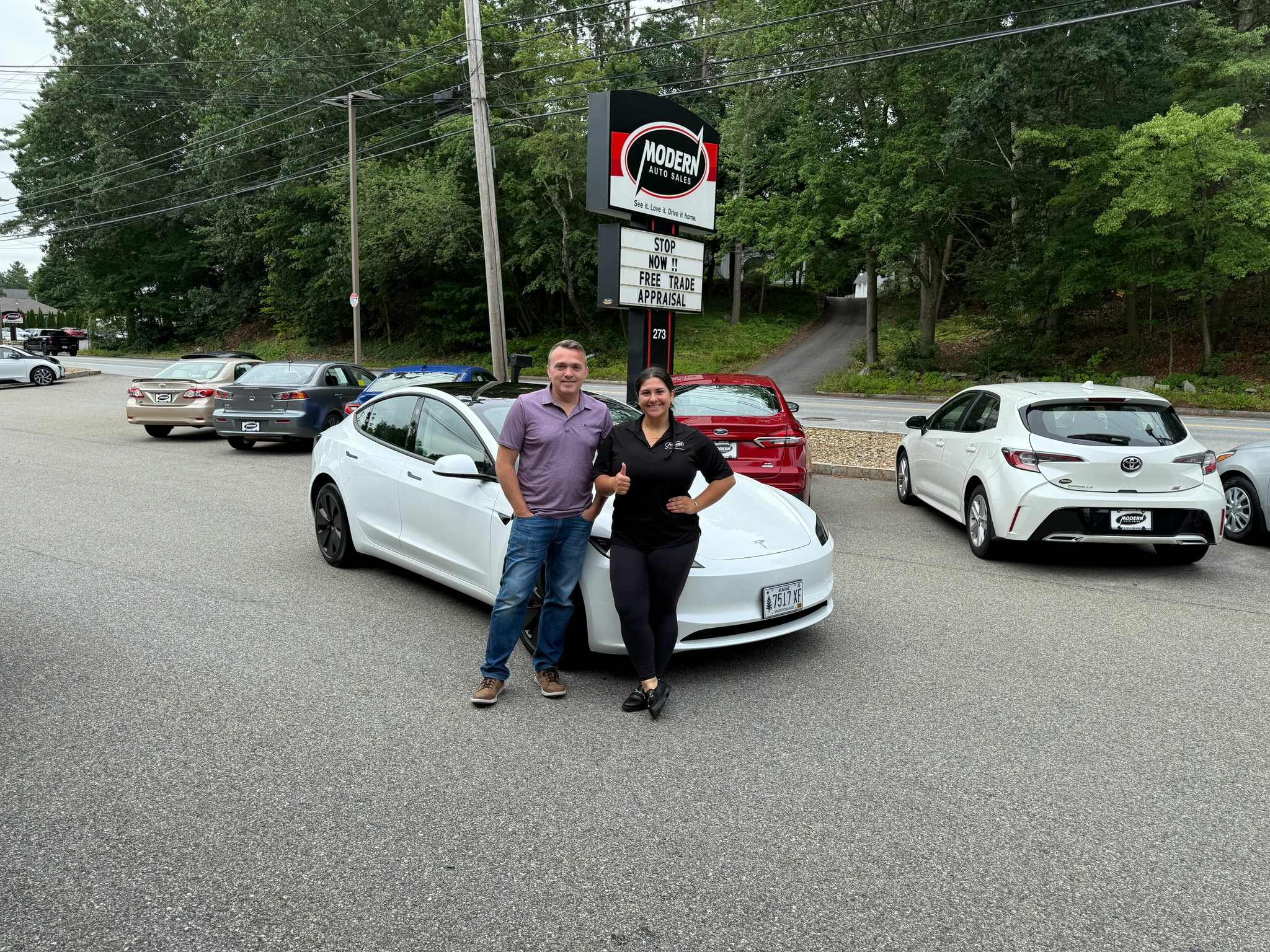 Happy Modern Auto Sales customer with new vehicle