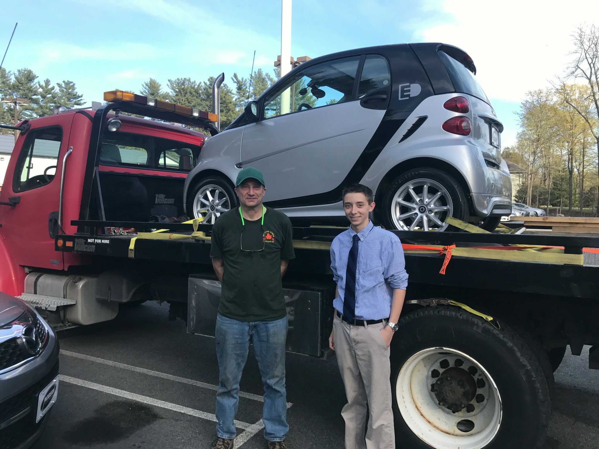 Happy Modern Auto Sales customer with new vehicle