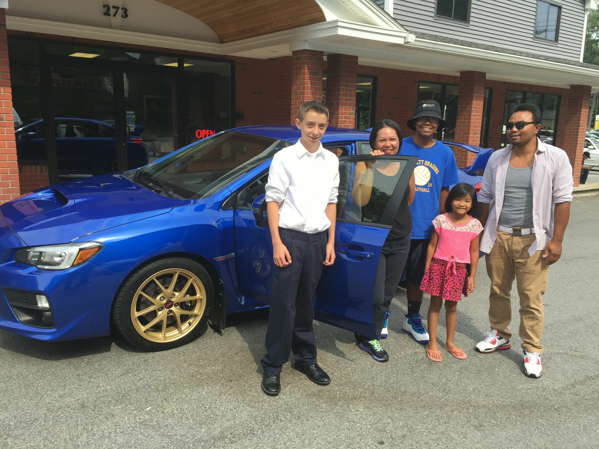 Happy Modern Auto Sales customer with new vehicle