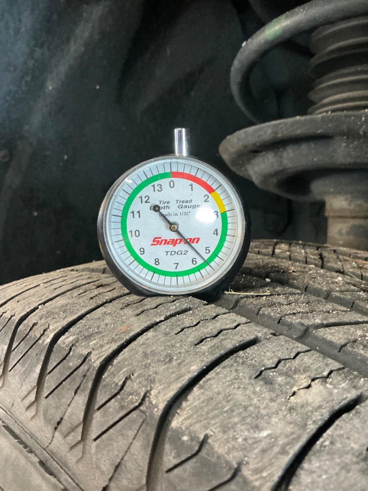 Measuring tire tread during vehicle inspection