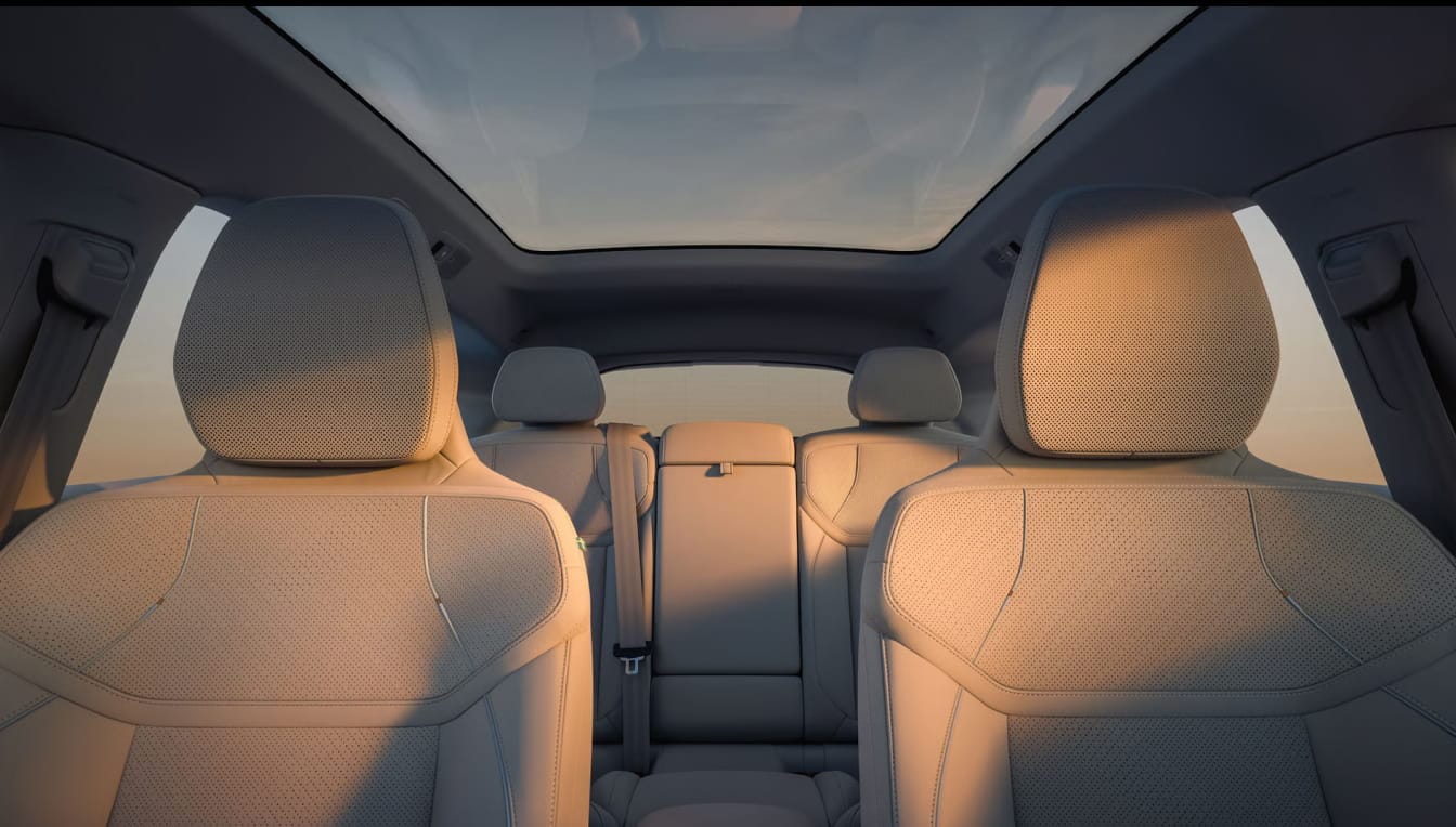 Interior view of a 2026 Volvo EX60 showcasing its spacious design with beige upholstery.