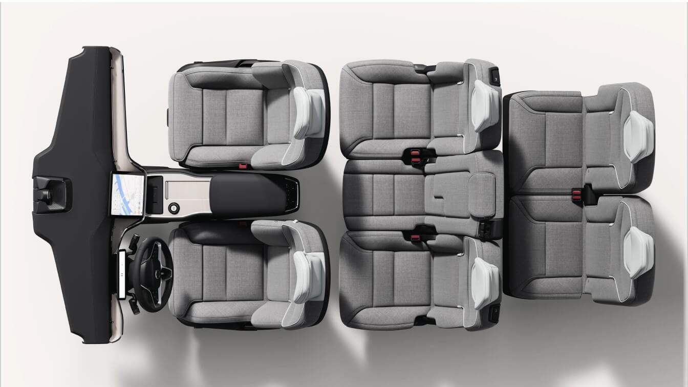 Top-down view of a Volvo EX90 Plus interior layout showcasing three rows of dawn nordico seats, dashboard, and center console.