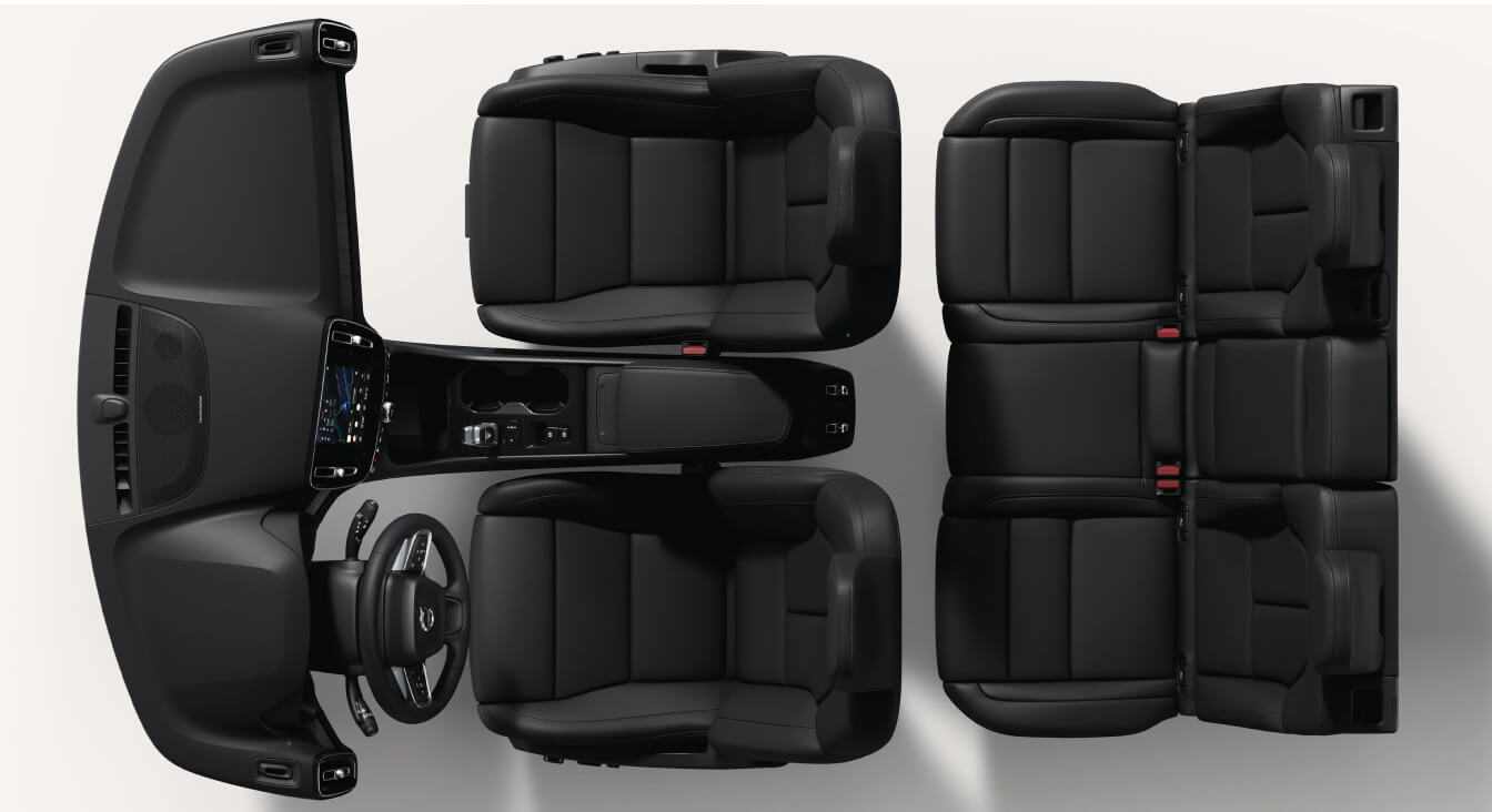 Top-down view of a Volvo XC40 Ultra interior layout showcasing charcoal leather seats, dashboard, and center console.
