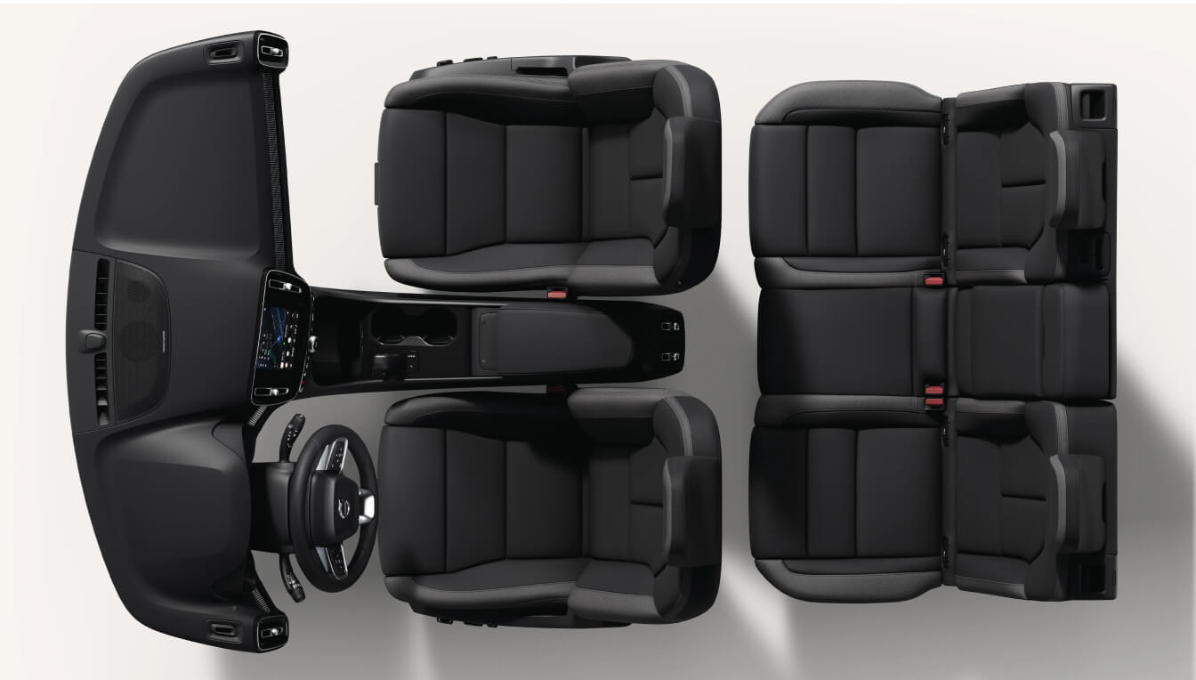 Top-down view of a Volvo EX40 Plus interior layout showcasing charcoal leather seats, dashboard, and center console.