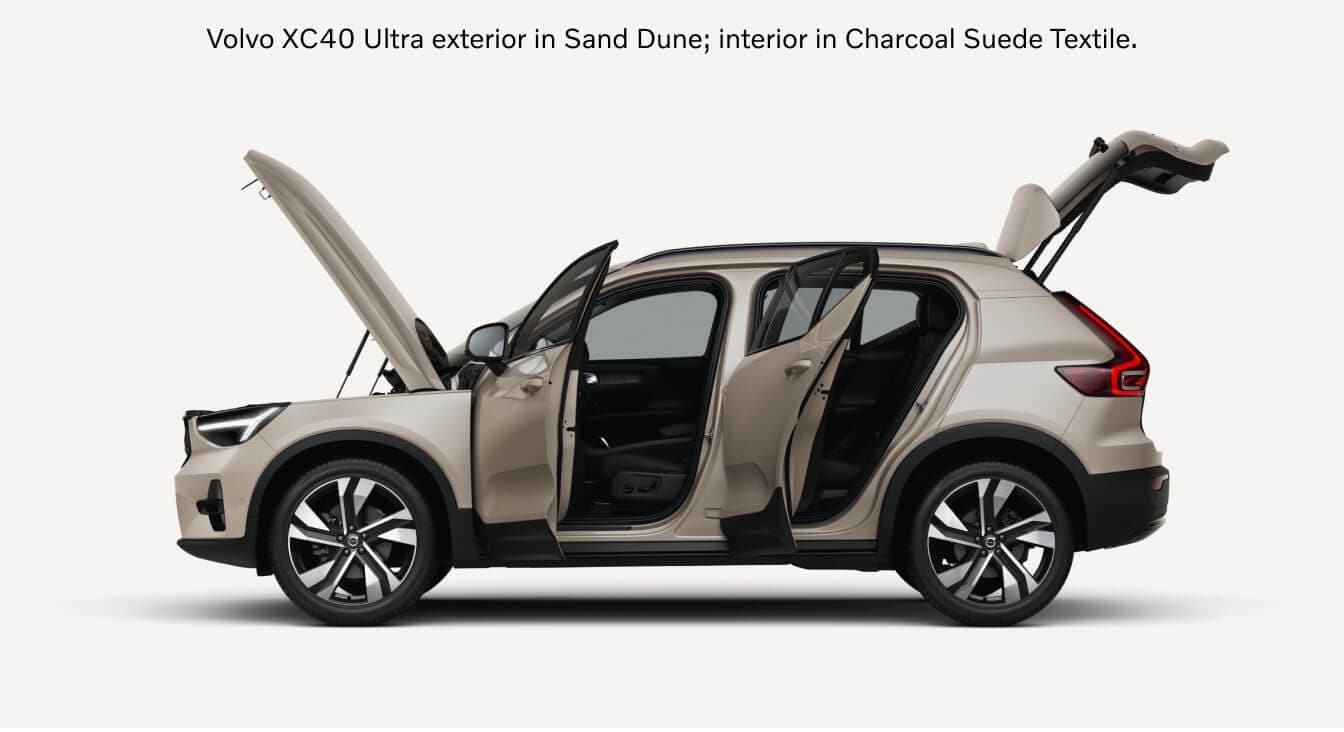 Side view of a Volvo XC40 Ultra in Sand Dune showcasing open doors, hood, and tailgate.