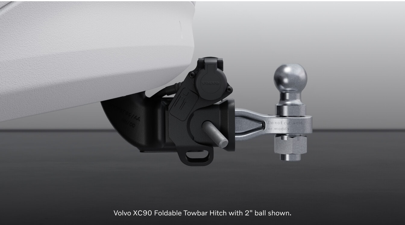 Studio view of a Volvo XC90 Ultra focusing on its foldable towbar hitch accessory with a two-inch ball.