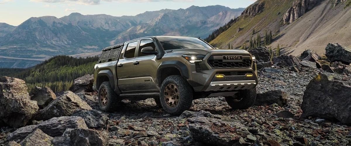 2025 Toyota Tacoma parked on a rocky mountain slope