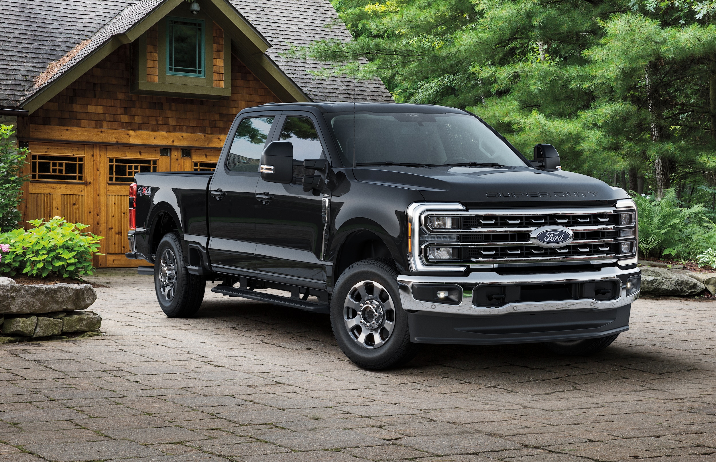 Black Ford F-250 in front of home 