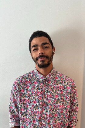 Staff member Caleb Zakora from ID_c6cc9f
