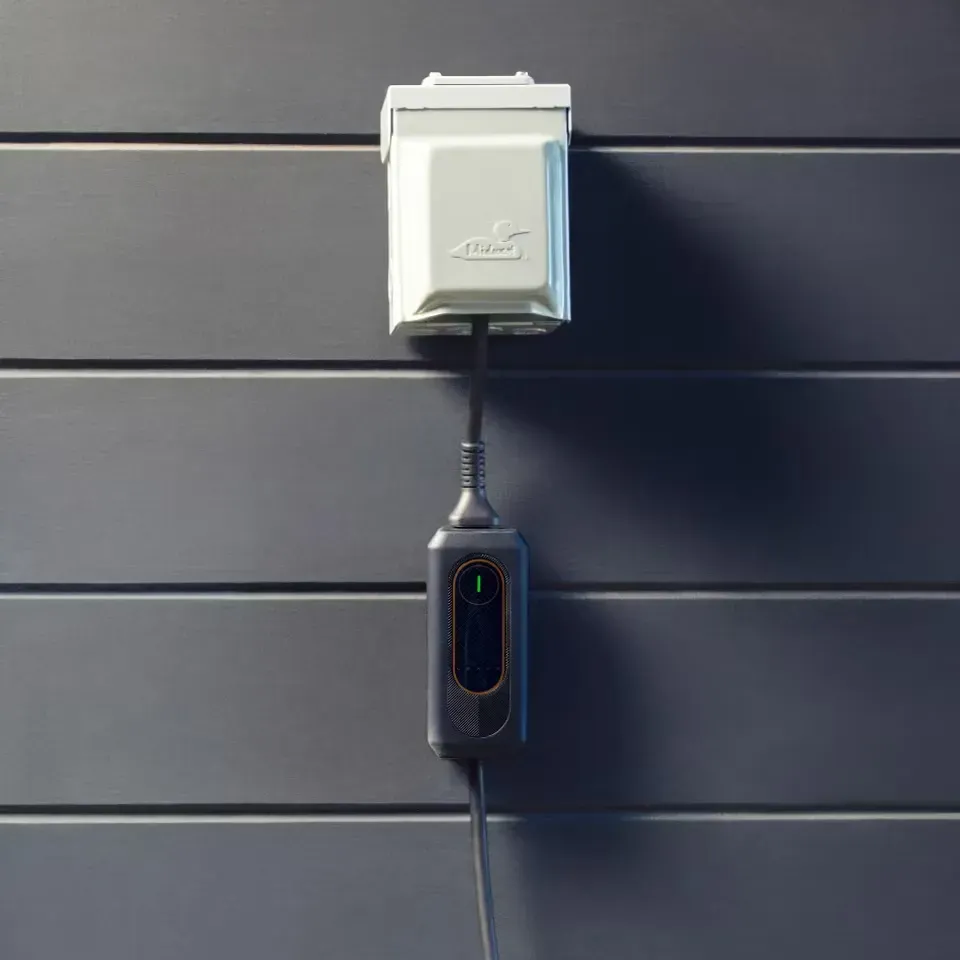 Lexus mobile charger hanging from outlet.