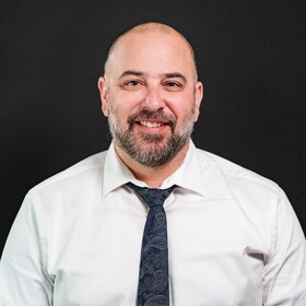 Staff member AARON GRASSEL from ID_833592de1d20