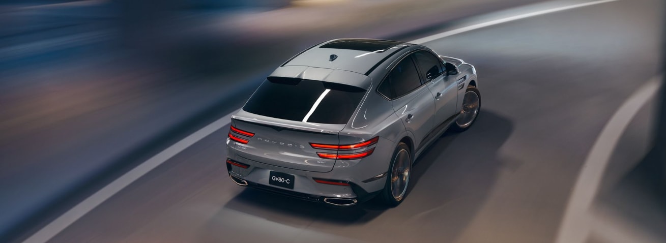 2026 Genesis GV80 Driving Rear.PNG