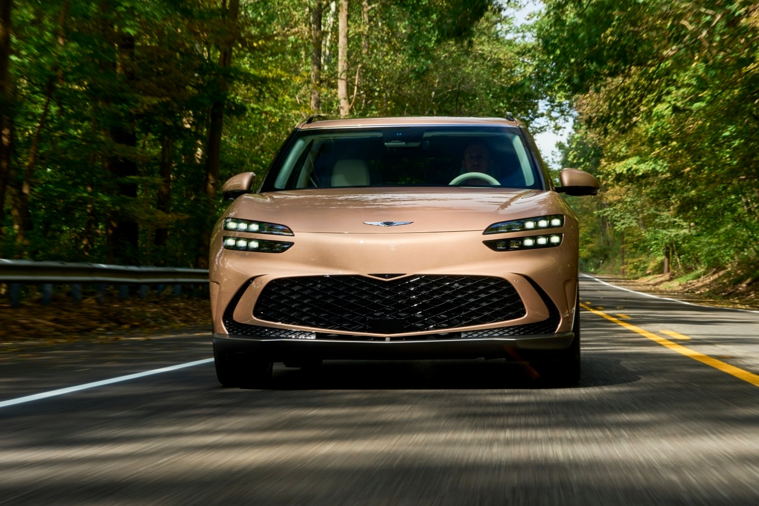 2024%20Genesis%20GV60%20on%20Wooded%20Road.jpg