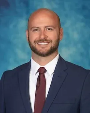 Staff member Austin Dry from ID_843455