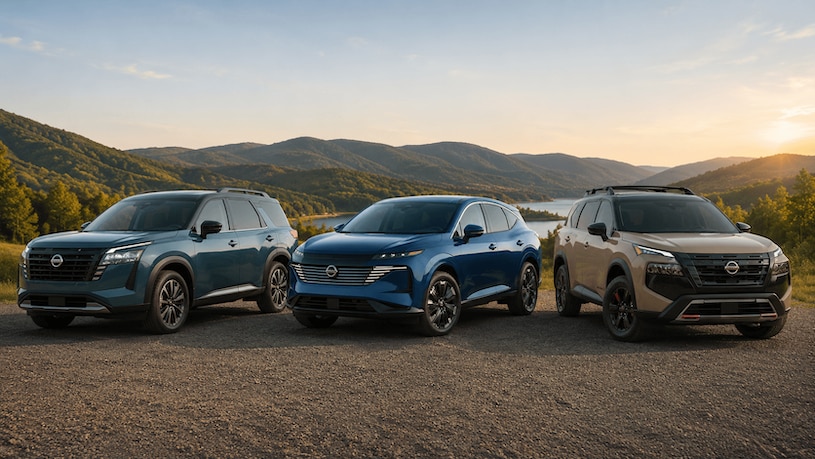 2026 Nissan Rogue, Murano, and Pathfinder parked side by side with rolling hills in the background