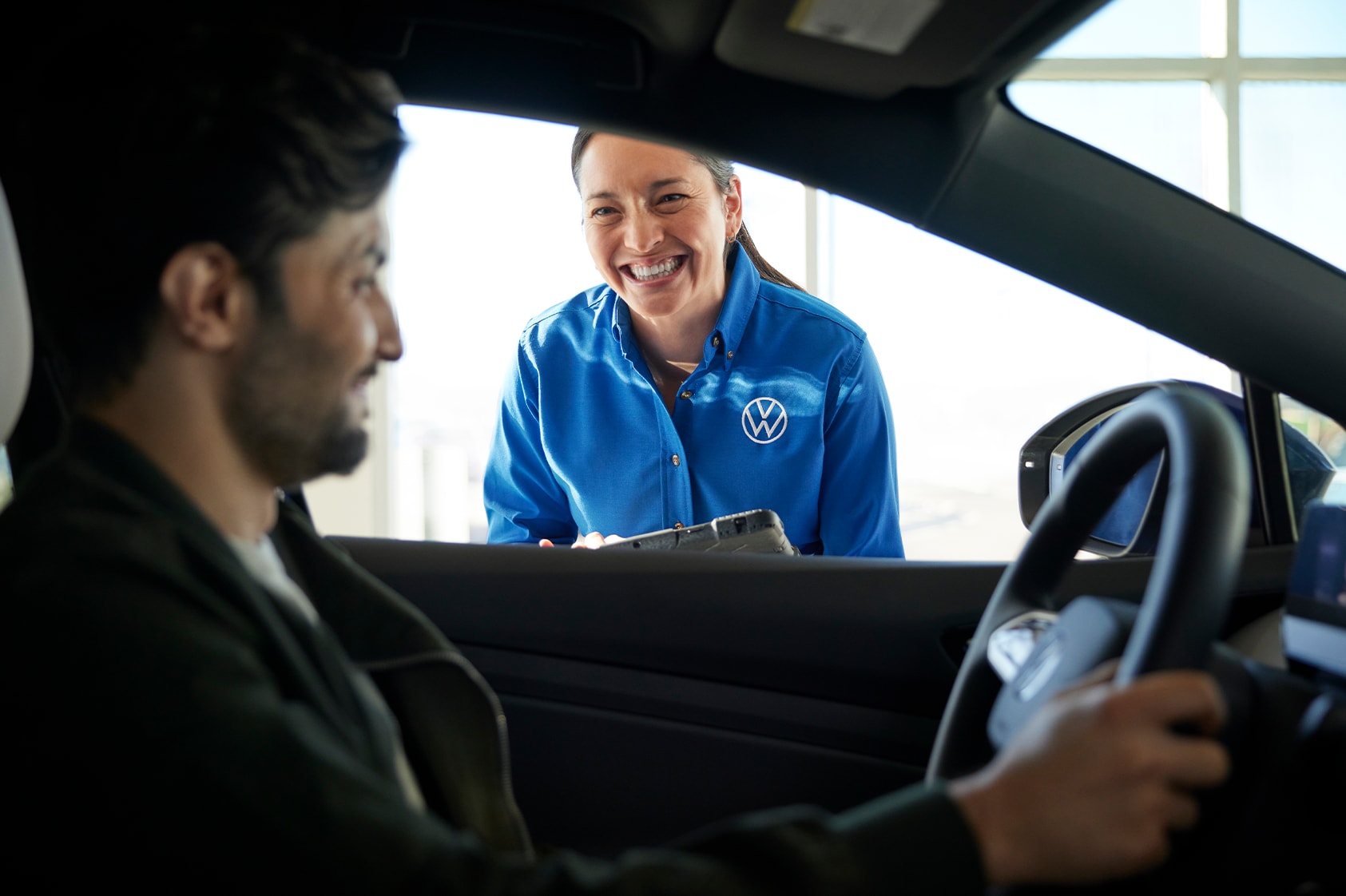 Volkswagen Service Advisor Welcoming Customer