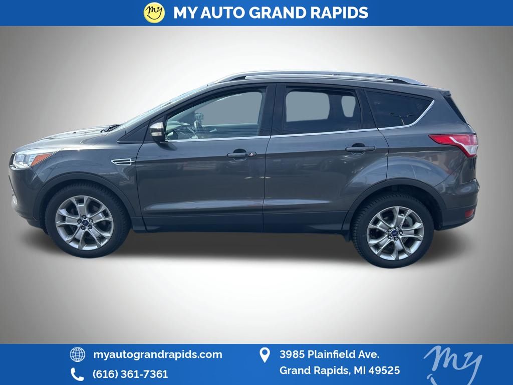 Used 2015 Ford Escape Titanium with VIN 1FMCU0JXXFUA06608 for sale in Grand Rapids, MI
