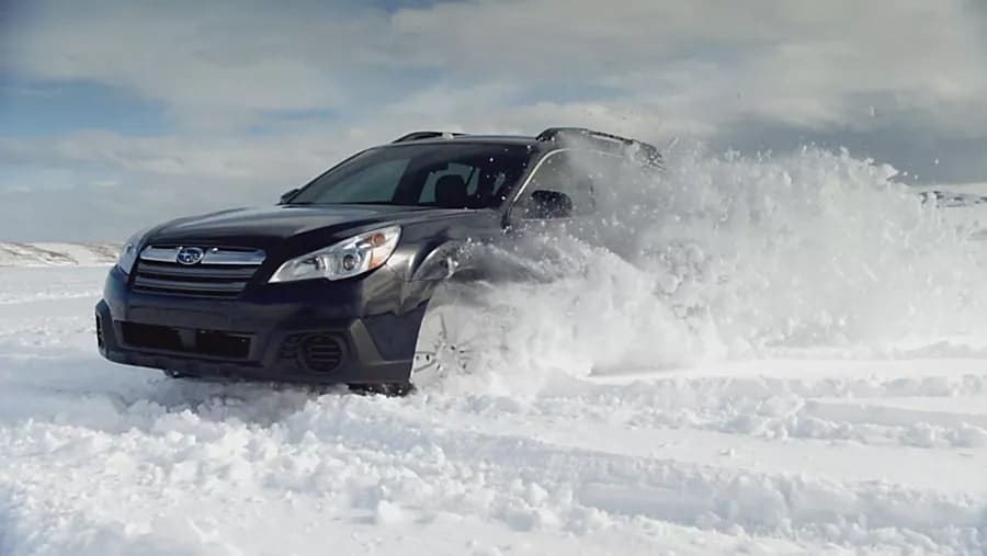 Subaru driving in snow