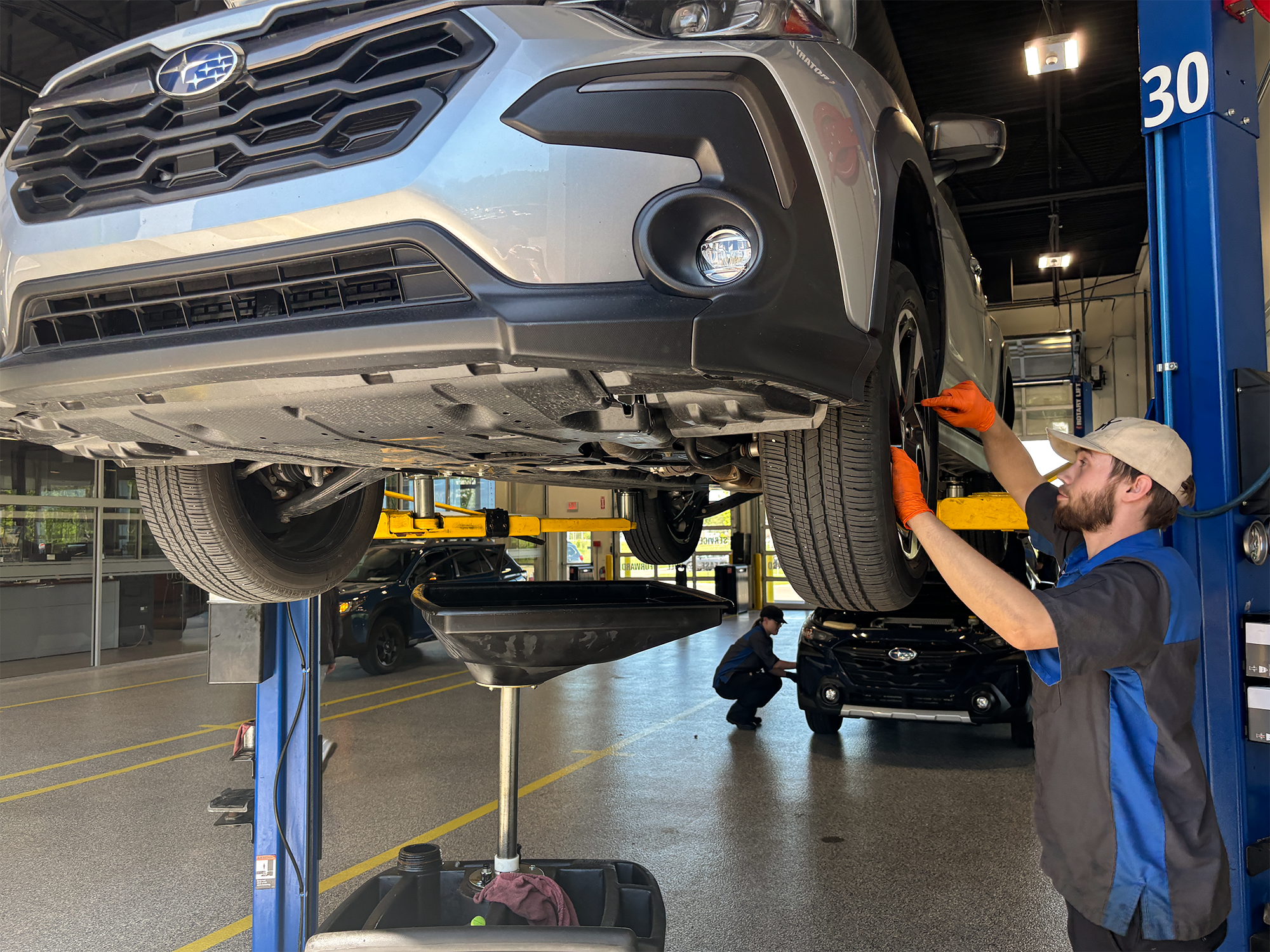 Subaru technician repairing axels