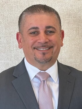 Staff member John Syriani from ID_5c7a1ff401e1
