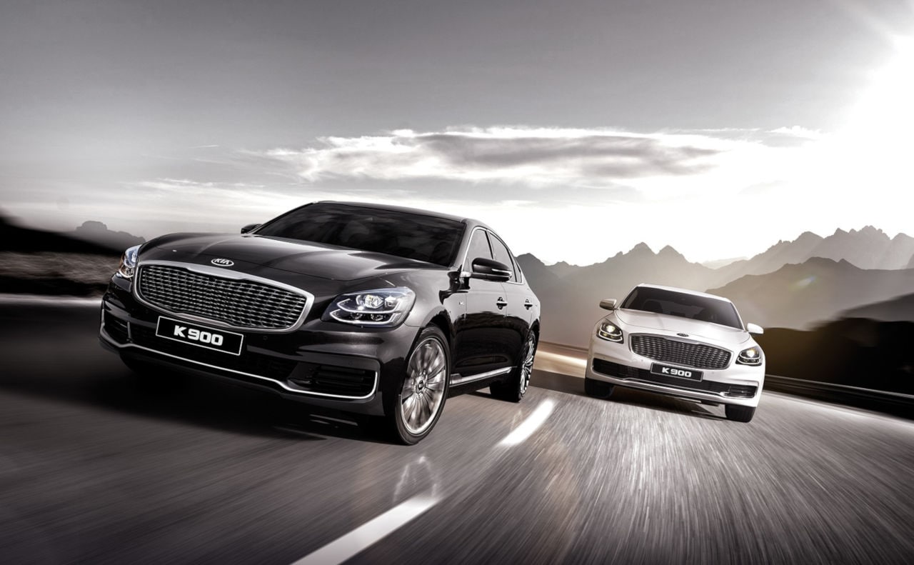 2019 Kia K900 Luxury Sedan Two Kia K900 Luxury Sedans on Highway with Mountains