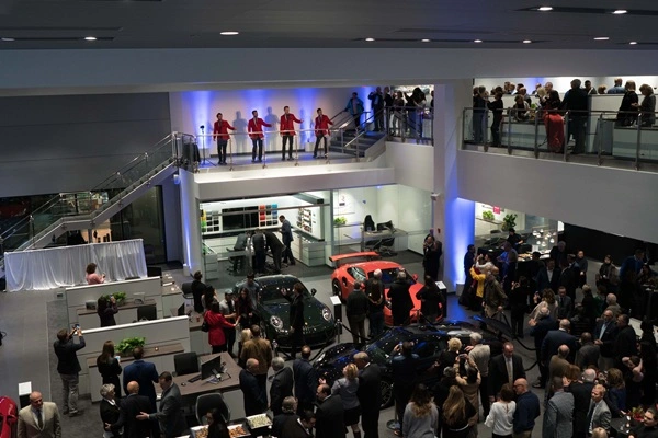 musical performance on the balcony at the napleton westmont porsche grand opening